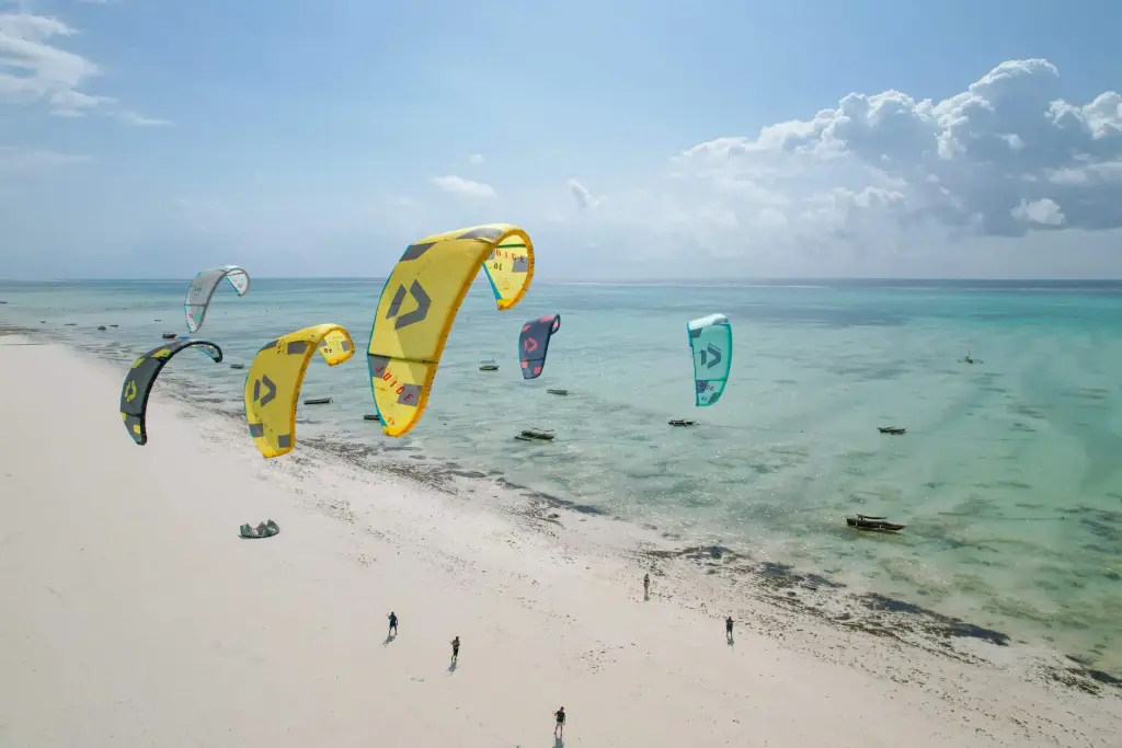 Kitesurfers on the turquoise water at Paje Beach, Zanzibar